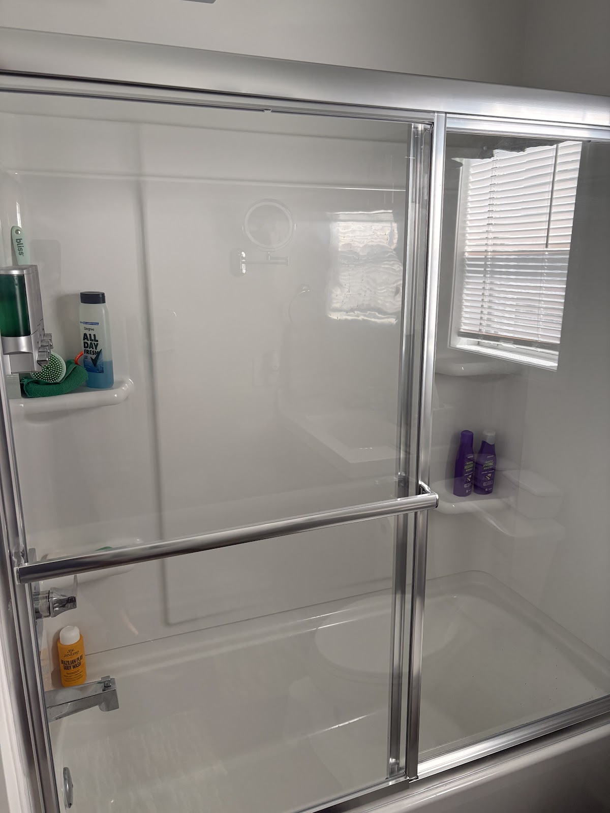 New tub and shower surround with sliding glass doors